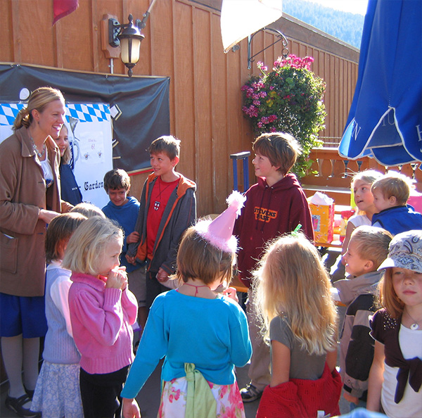 Owner pam talking to a group of children.